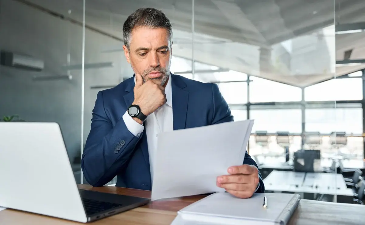 Business Man Reviewing Document Email Header Image