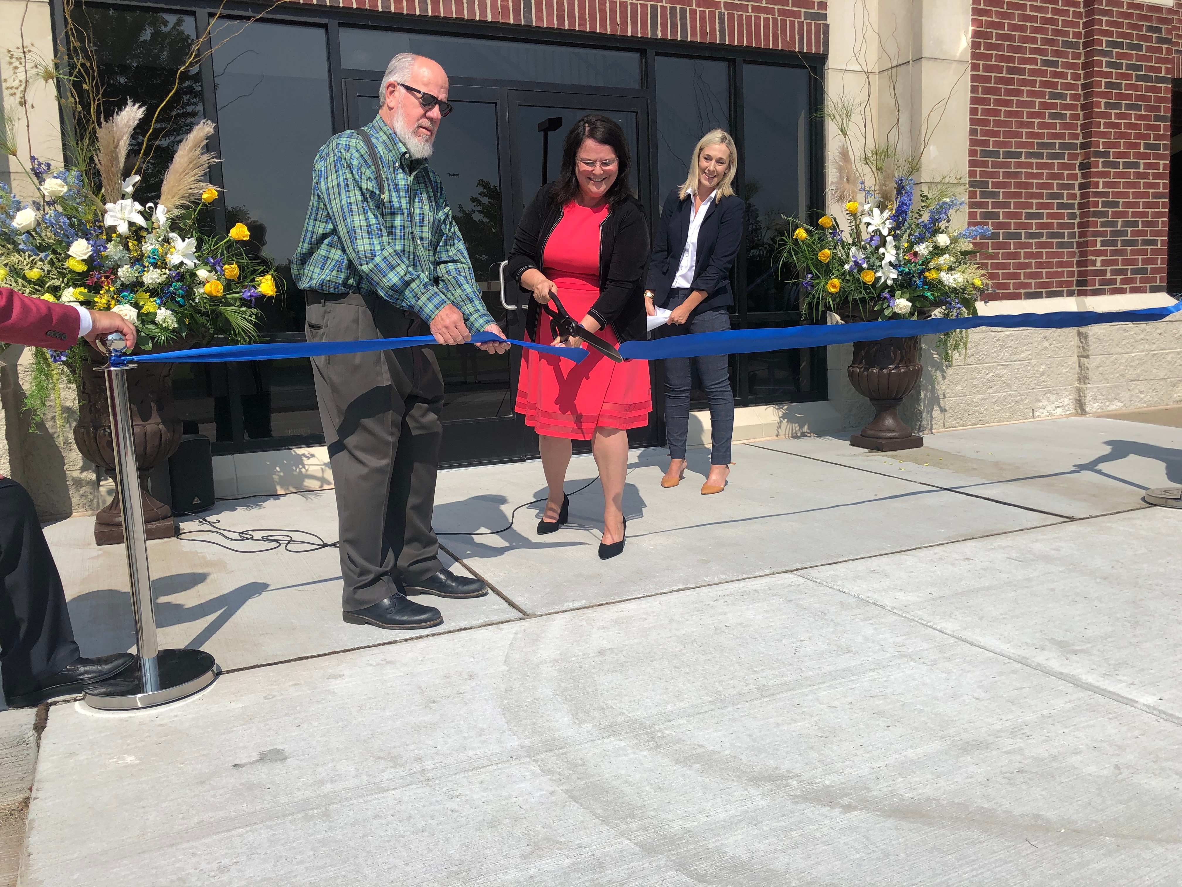 District Founder Chuck Stockwell, CSAMS Principal Dina Barnaby and Interim Exec. Director Jessica Moceri cut the ribbon