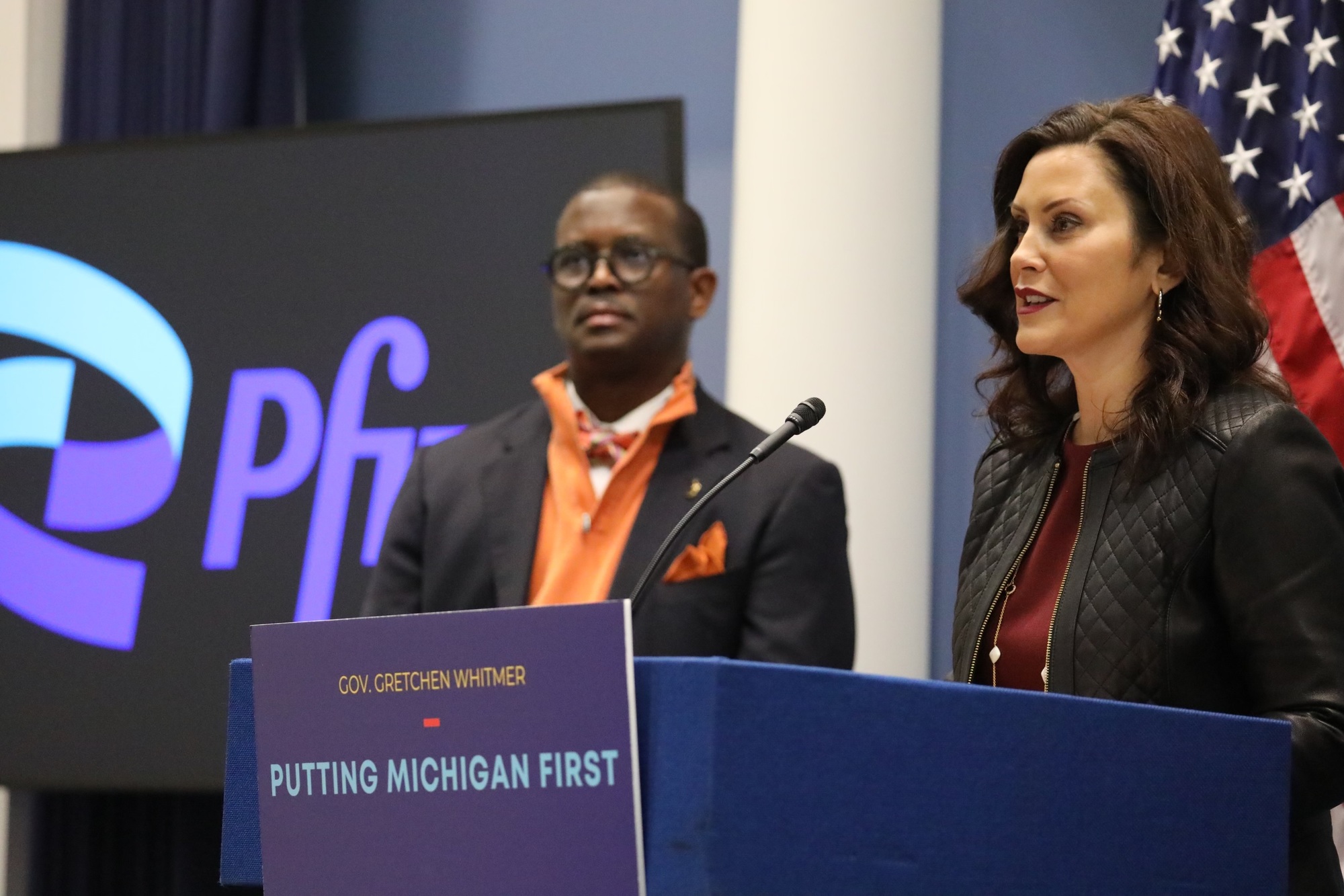 Gov. Whitmer speaks at podium during Pfizer announcement