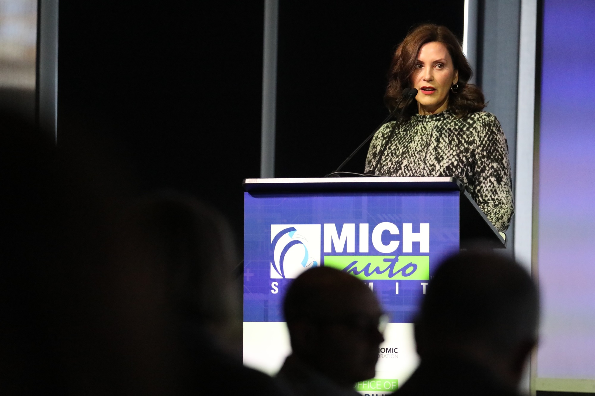 Gov. Whitmer speaks at podium during event 