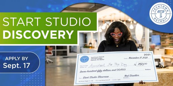 Women very exciting hold a check for $750