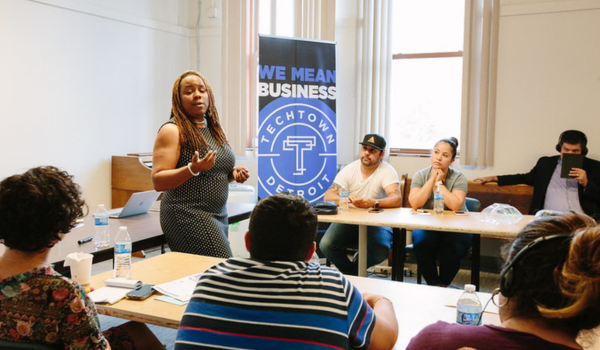 A group of 313 STRONG clients in a workshop in Southwest Detroit