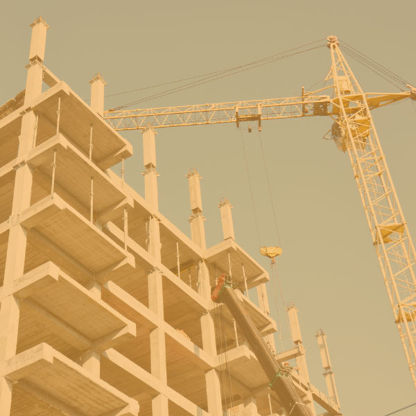 A construction crane works on a building.