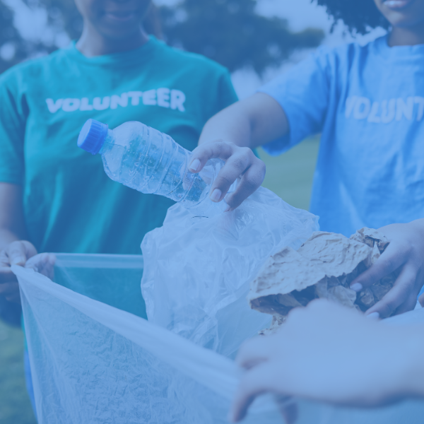 Volunteers throwing trash away.