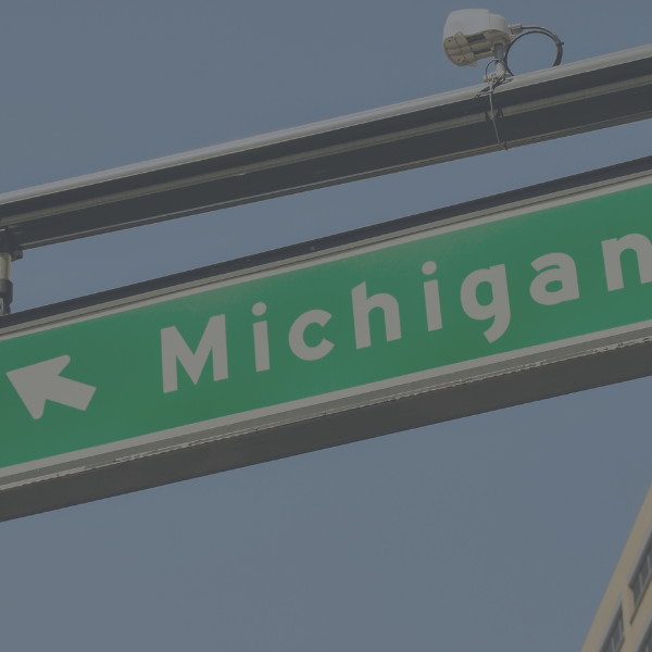 A green road sign indicating Michigan