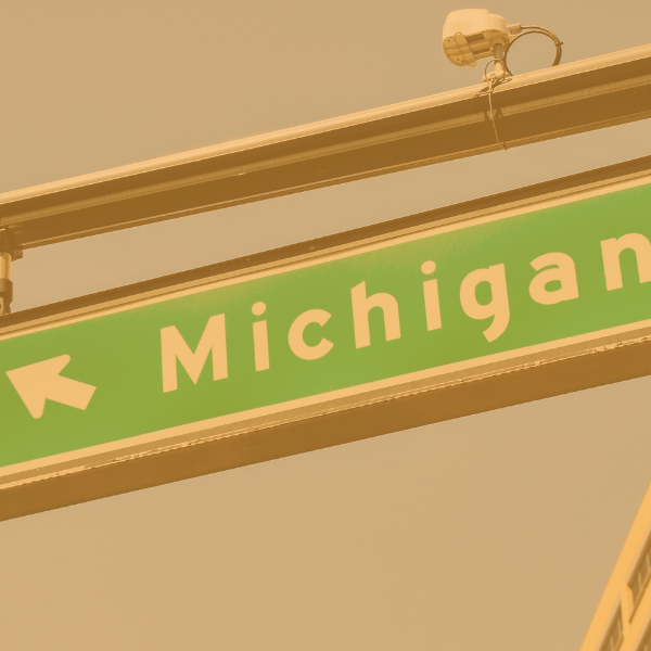 A green road sign indicating Michigan