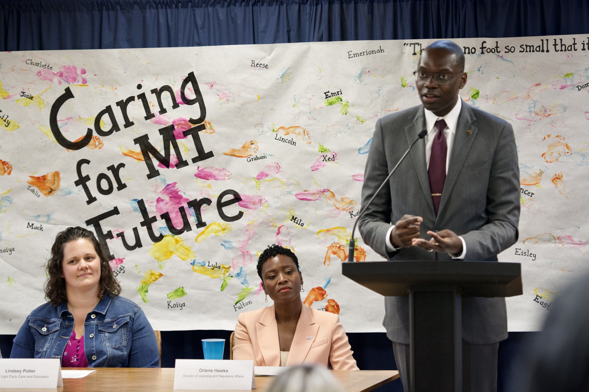 Lt. Gov Gilchrist speaks at podium during Caring for MI Future event 