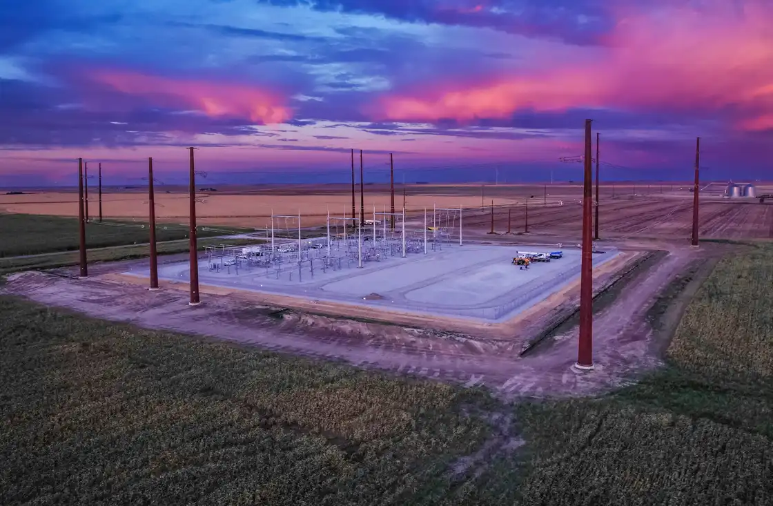 Power supply facility sits before a purple and blue sunset
