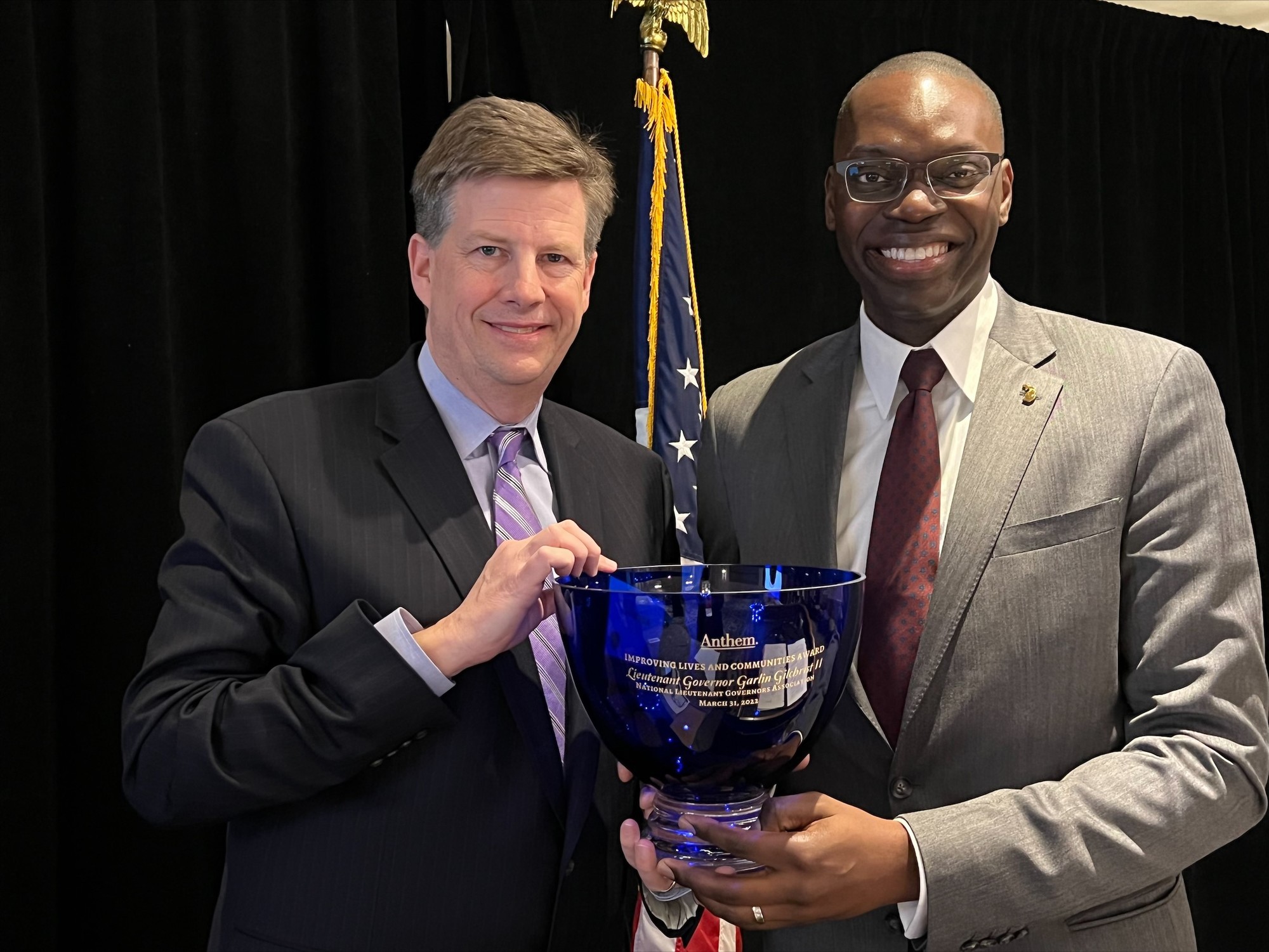 null Lt. Gov Gilchrist holding the the National Lieutenant Governors Association Improving Lives and Communities Award