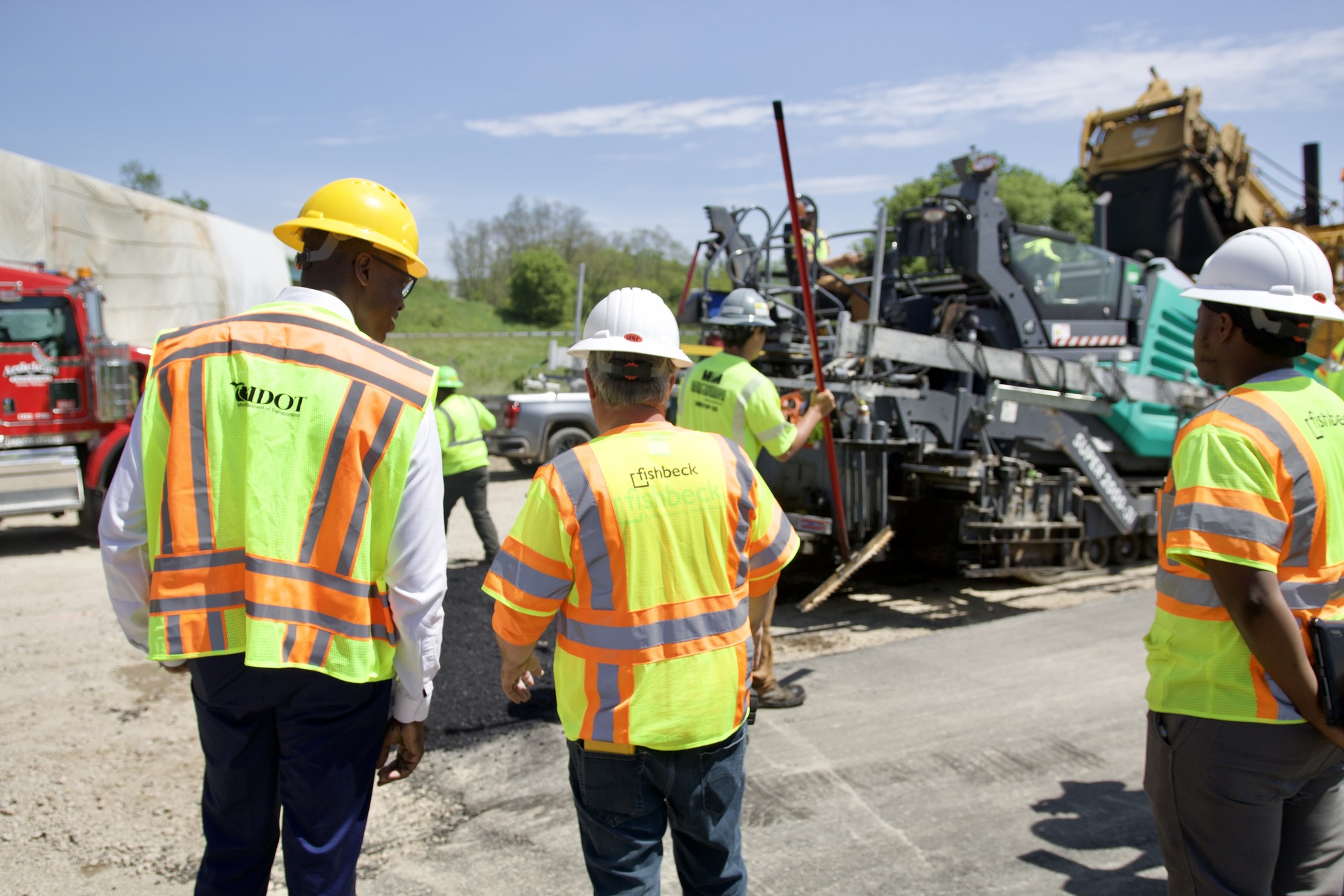 Lt. Gov talks with the road crew during a visit to see road repairs