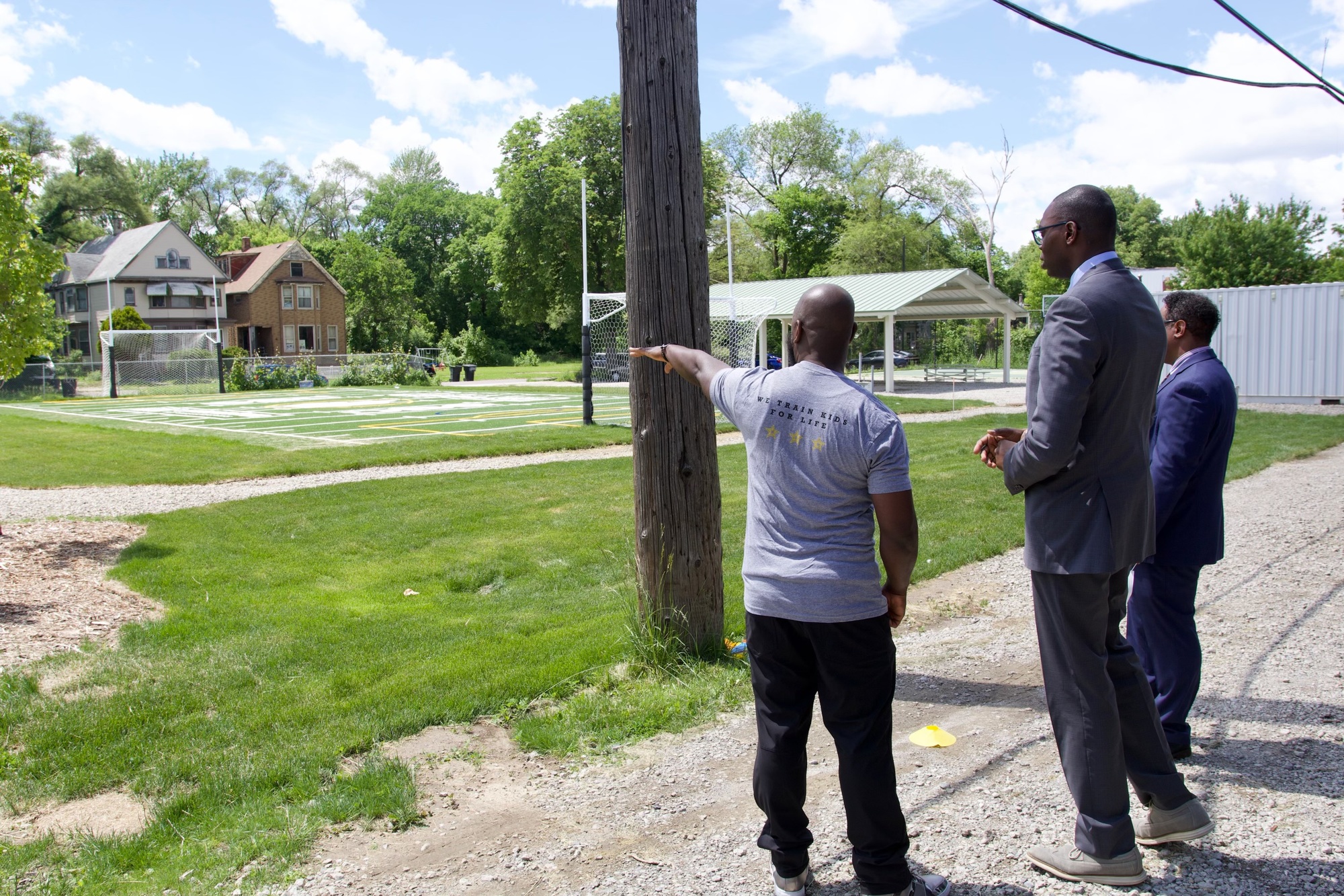 Lt. Gov looks out at field and houses at the event 