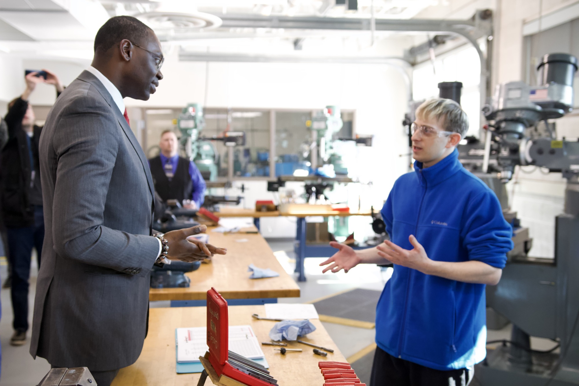 Lieutenant Governor Gilchrist talking with Reconnect student