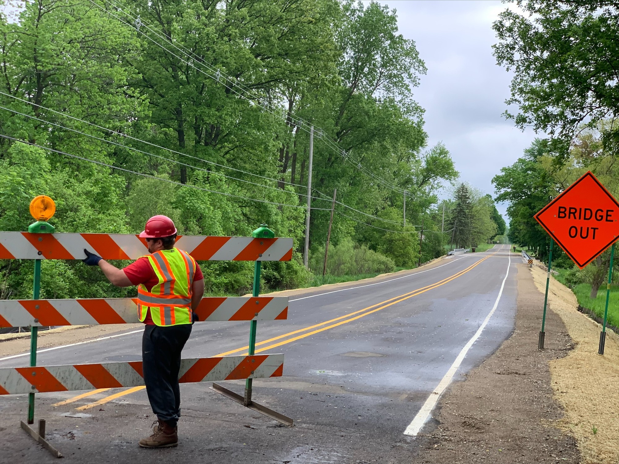 Worker Removing Barricade from West Side of Herbison Bridge