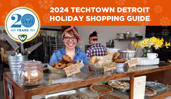 A graphic featuring a person smiling and standing behind a bakery counter with a display of desserts and pastries. At the top of the graphic is the text